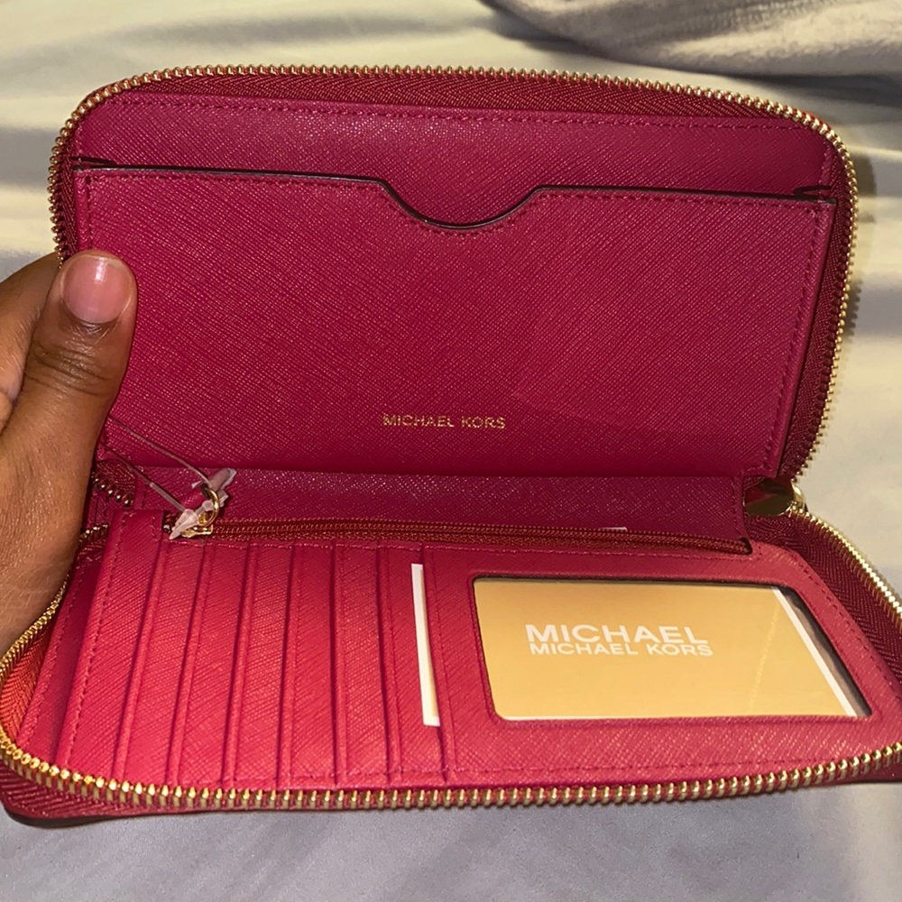 Michael Kors dark pink wristlets